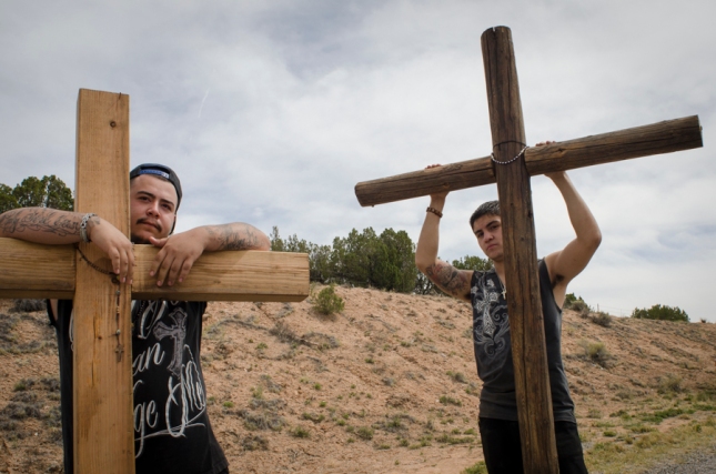Bearing the weight of wooden crosses, Troy Martinez (left) and Nick Ortiz travel the “High Road to Taos” for the third consecutive year en route to El Santuario de Chimayo on Good Friday, April 18, 2014. Many pilgrims carry rosaries and crosses to pray for and honor loved ones. (AP Photo/Jeremy Wade Shockley)